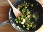 closeup of pan roasted brussels sprouts with shallots, garlic, and white wine